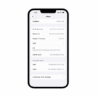 Apple iPhone 14 settings screen displaying device information, storage details, IMEI numbers, and carrier unlock status on a clean white background.