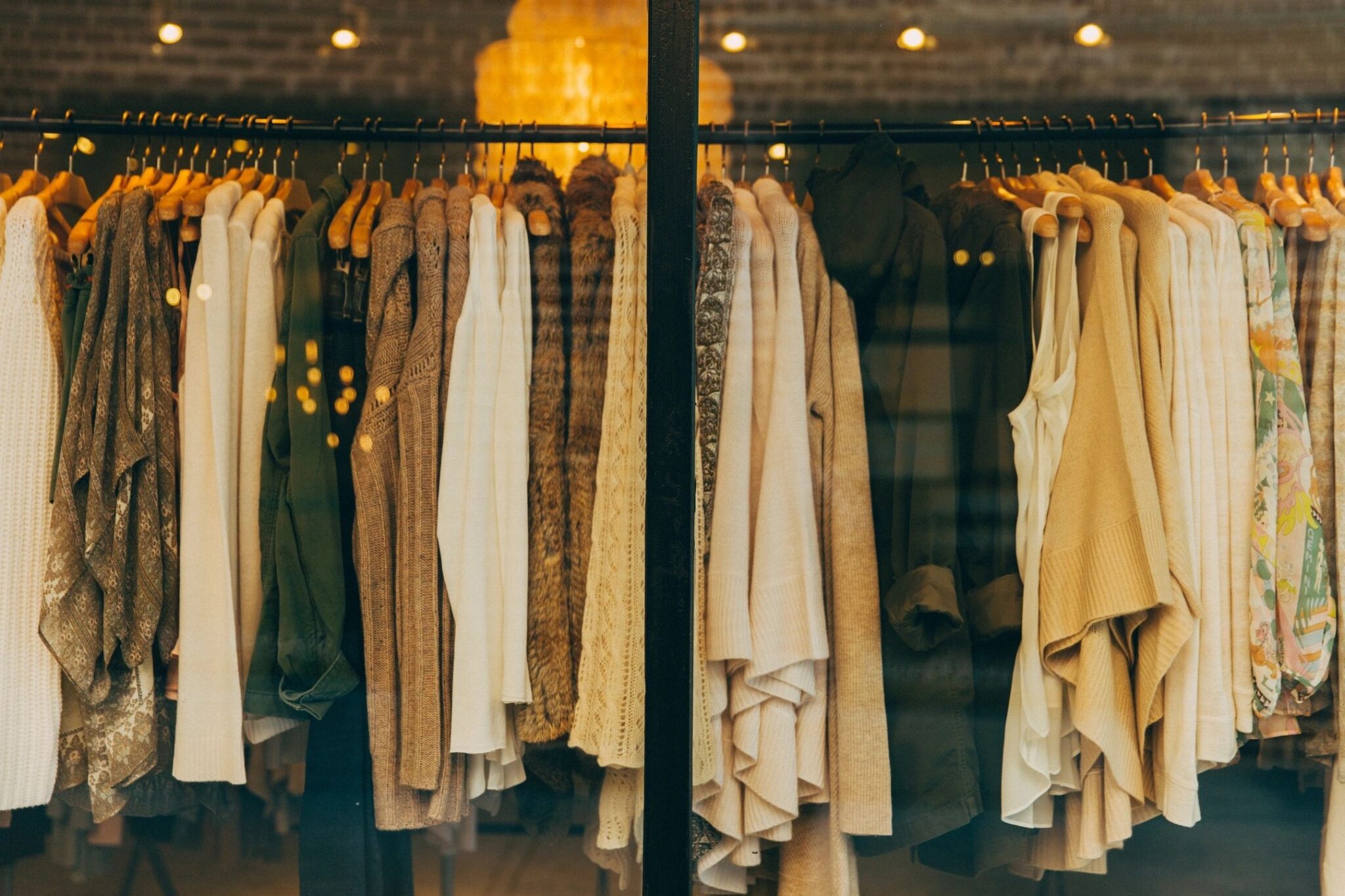 Clothing rack filled with assorted fashion pieces in various colors and styles. Electronics, Fashion and Home Décor